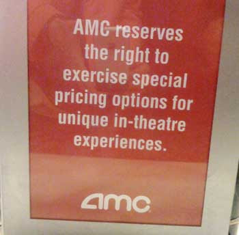 Red sign with white letters reading AMC reserves the right to exercise special pricing options for unique in-theatre experiences.
