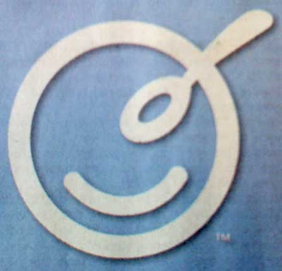 Light blue background with a white circle. Curved arc inside bottom half of circle, and a spoon shape at top right, the handle hanging out of the top of the circle