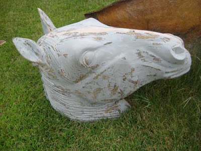 Gray fiberglass horse head.