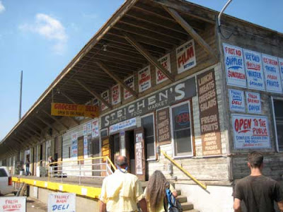 Exterior of Steichen's market with signs all over it