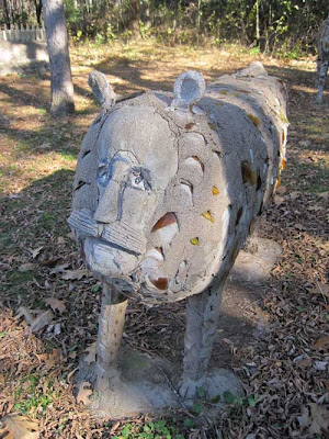 Lion-like animal with human face, including human nose and mustache