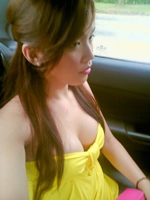 an unknown pretty filipina showcases her bumper in her yellow bodyhugging 