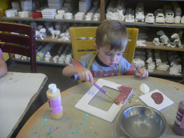 Tommy painting Daddy's Father's Day ASU Frame