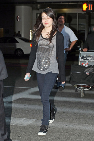 Miranda Cosgrove seen arriving at LAX in a cheeky Lauren Moshi top and some