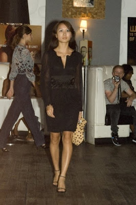 Black dress by Vivienne Tam paired with YazBerry Polka Dot Clutch