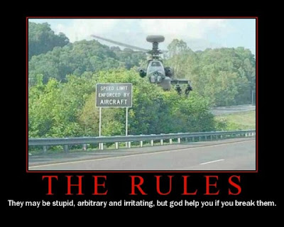 photo of an apache? helicopter hovering behind a speed enforced by aircraft sign