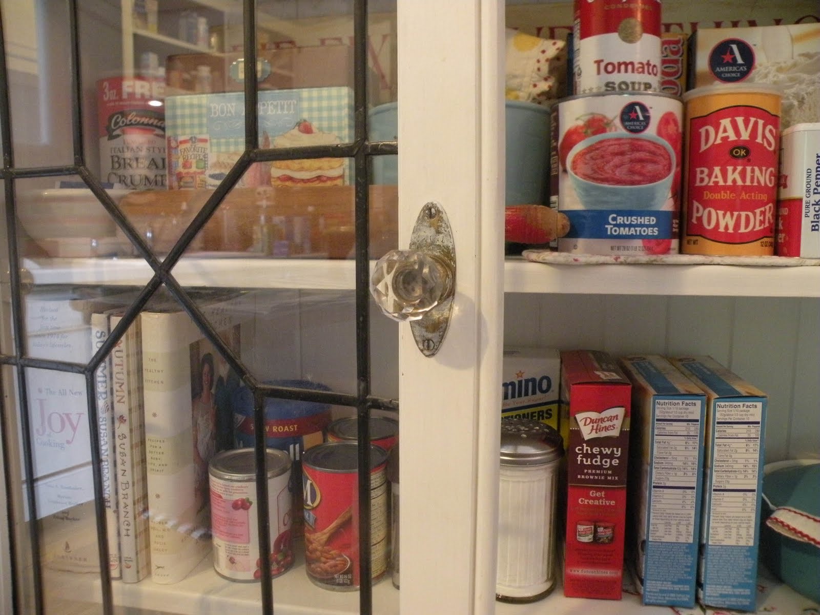Shelf paper for kitchen cabinets mixed in some of my cookbooks and a few vintage treasures to balance