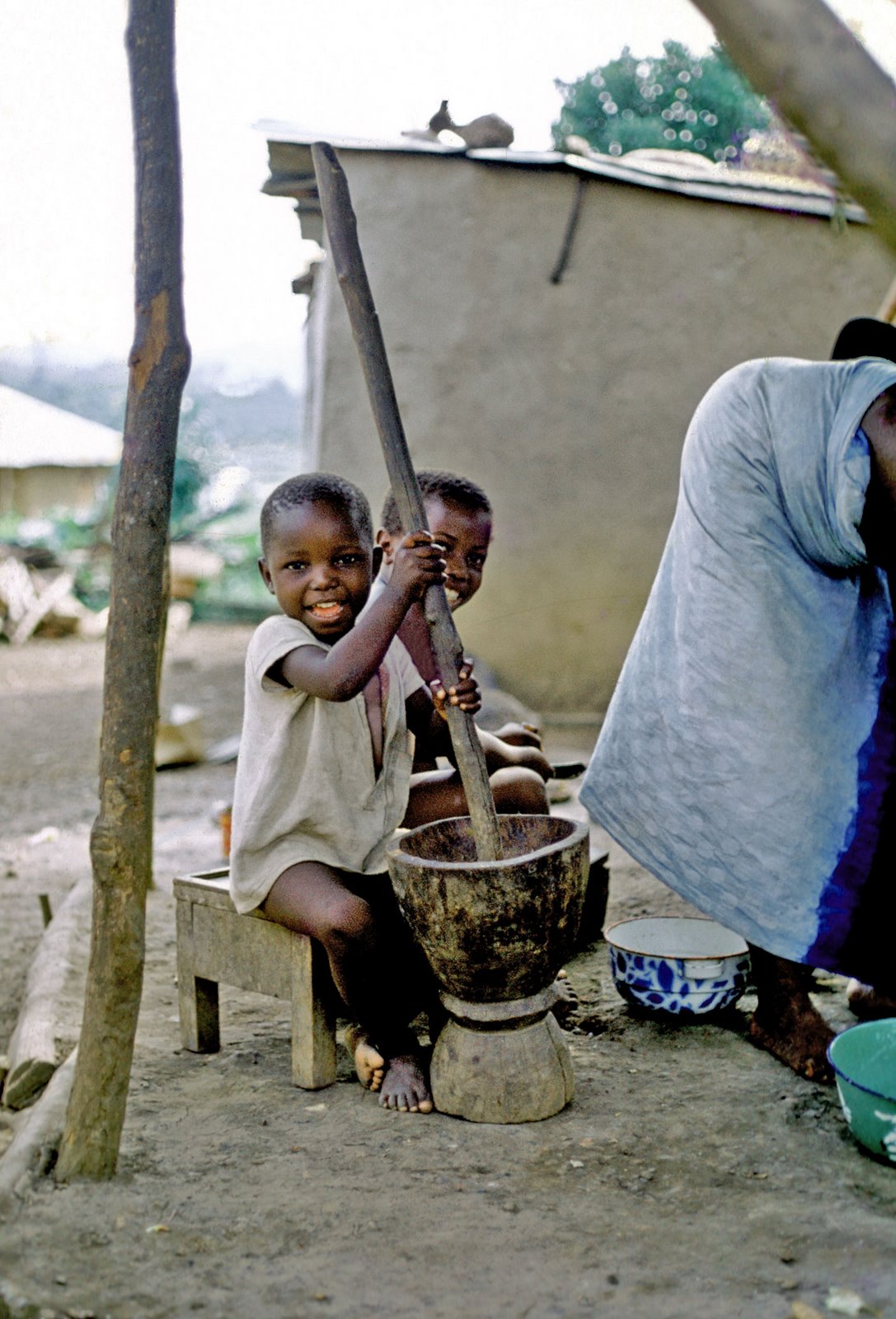 Tejani and sister in kitchen - Dama Rd in Kenema