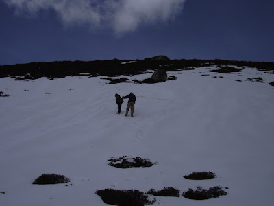 Paul and Lobsang crossing snowfields approaching the summit