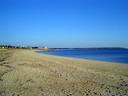 . to the beach, where there were both sailing and surfboarding schools. (beach)