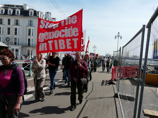 Mokshini and a friend from FWBO, ( Friends of Western Buddhist Order ) carrying banner.