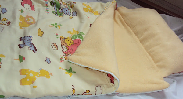 Cobertor/saco de dormir amarillo_$10.000_