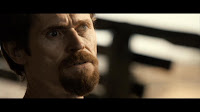 Willem Dafoe as Lionel 'Elvis' Cormac