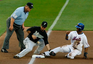 Joe West gets a great view of Reyes sliding in safely to third