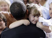 The President holds a 4 year old girl