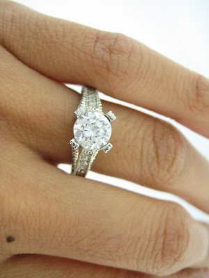 This split shank diamond wedding ring has 068 Carats in round pave diamonds