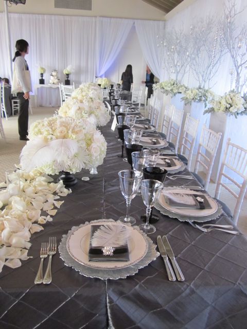 An elegant combination of hundreds of white roses feathers bling An elegant combination of hundreds of white roses feathers bling