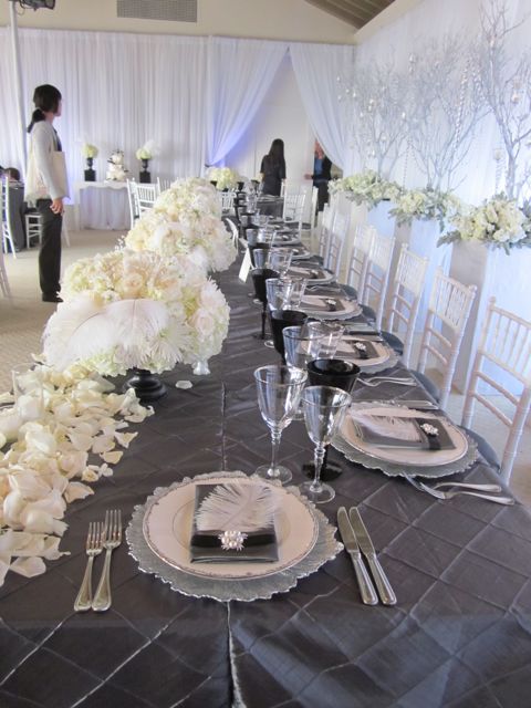 An elegant combination of hundreds of white roses feathers bling 