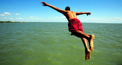 A boy jumps into the water of Cocibolca lake at the colonial city of Granada, some 29 miles south of Managua