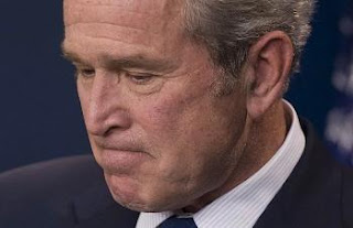 Bush scowls during presser