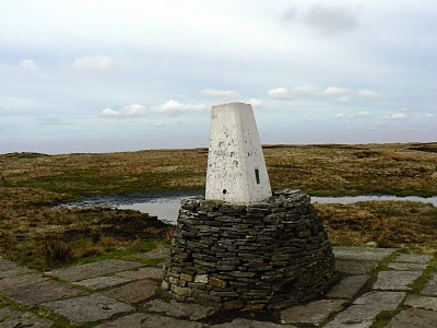 The trig point on Black Hill was rebuilt on a stone plinth to stop it from succumbing to the surrounding peat bog