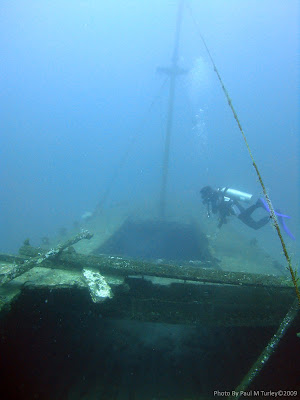 Coral Canyon Wreck looking over the decks while Abdul examines the hold, Pemuteran, Bali