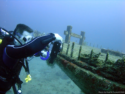 Diver Simon photographs critters on Coral Canyon Wreck, Pemuteran, Bali