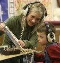 Me hard at work reading a book on tape with a little boy with Autism
