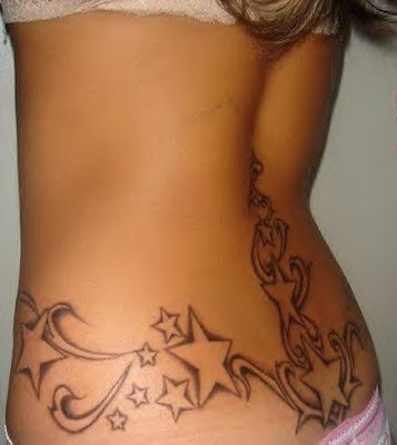 lower back butterfly tattoo. origins ack tattoo.