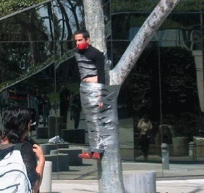 crazy+man+tied+to+tree.jpg