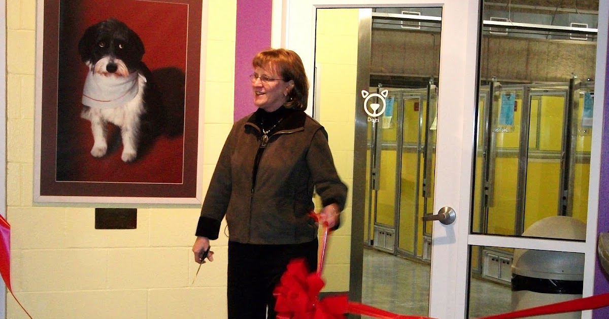 South Kansas City Observer Wayside Waifs Cuts Ribbon on New Doggie Kennels