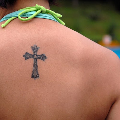 Small Cross Tattoo on Girls Upper Back