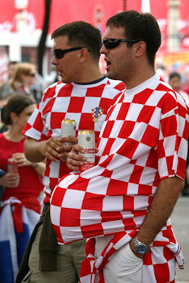 Fans Enjoying and Watching Football