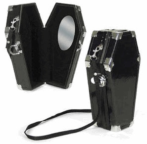 A purse shaped like a coffin A purse shaped like a coffin