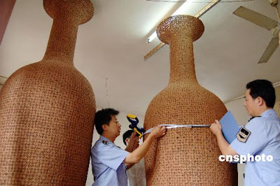 A pair of vases made of walnuts A pair of vases made of walnuts