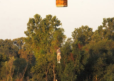 Rick Ashby hanging on to a rope Rick Ashby hanging on to a rope
