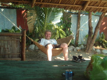 Club Tropical DJ in a Cruise ship style swinging rope hammock under the sun