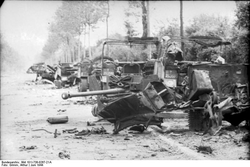 [The+wreckage+of+the+1st+Rifle+Brigade's+transport+column,+and+a+6+pounder+anti-tank+gun,+on+the+road+between+Villers-Bocage+and+Point+213.jpg]