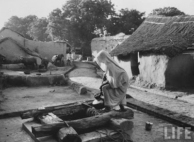 Indian+woman+drawing+water+from+one+of+several+shallow+wells+in+village+-+October+1962