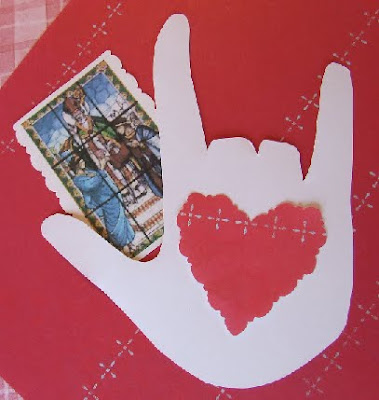 Paper ASL love hand with Saint Valentine card