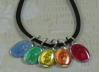 Black rope necklace with colorful metal pendants
