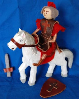 Doll set of Saint George with a sword and shield riding a horse