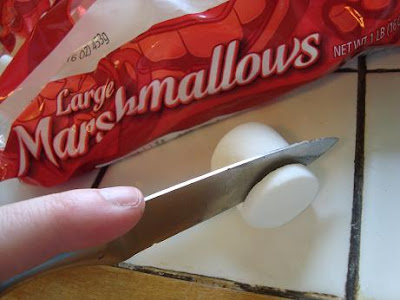 Knife slicing marshmallow