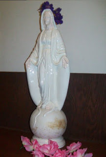 Statuette of Mary wearing flower crown