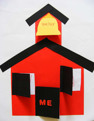 Red, black, and yellow construction paper made into a school house