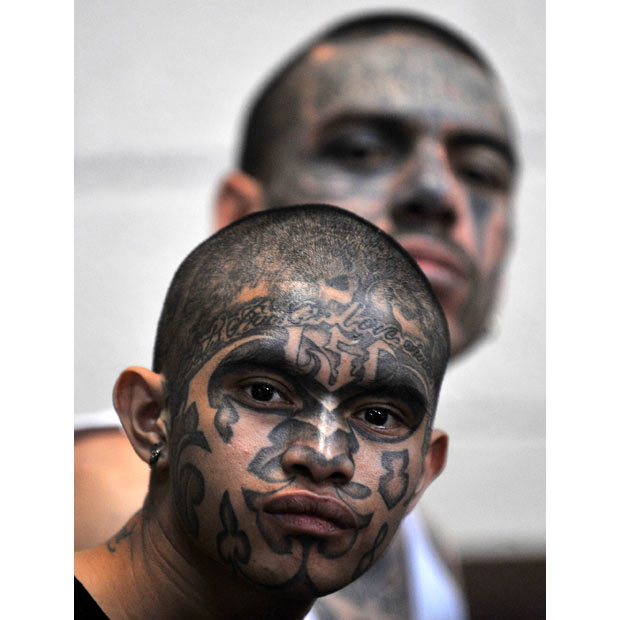 Tattooed members of the Mara 18 gang are held at a courtroom in Guatemala Tattooed members of the Mara 18 gang are held at a courtroom in Guatemala