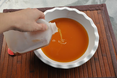 pouring apple cider in white bowl