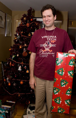 John poses with a rather tall gift from his mother-in-law, 'P.A.T.'