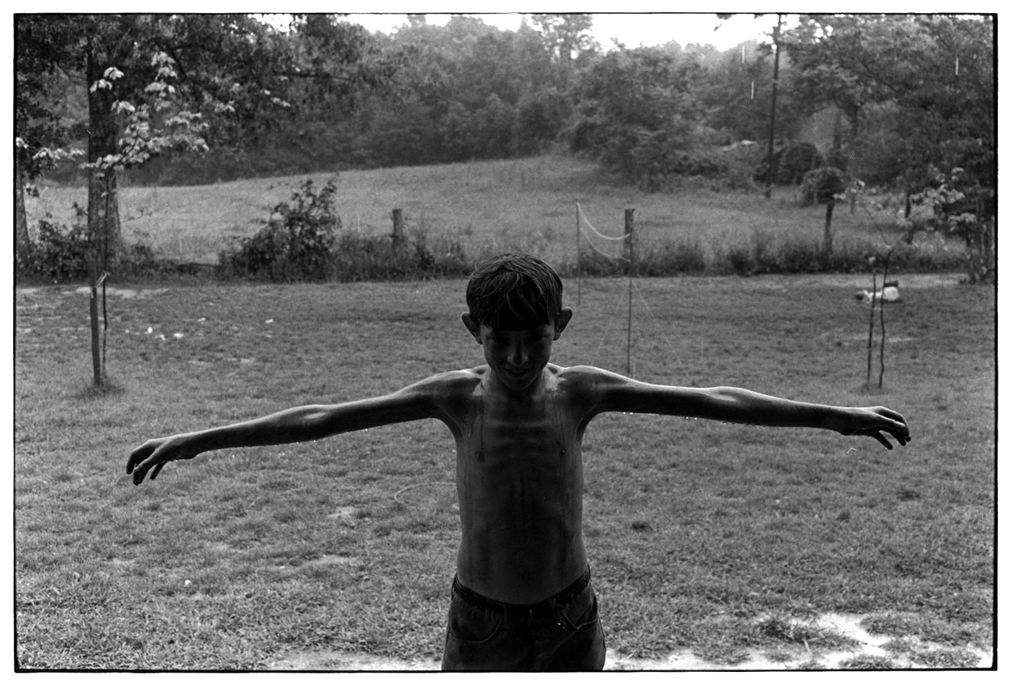 WILLIAM GEDNEY COLLECTION: Wet boy standing outside with 
