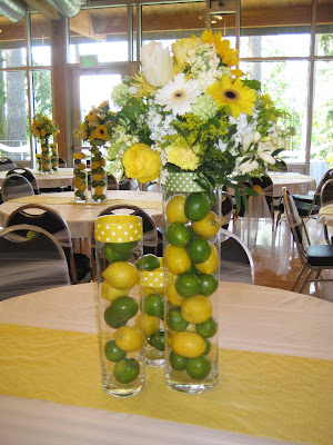 Now at the wedding reception the limes and lemons in the tall vases were 